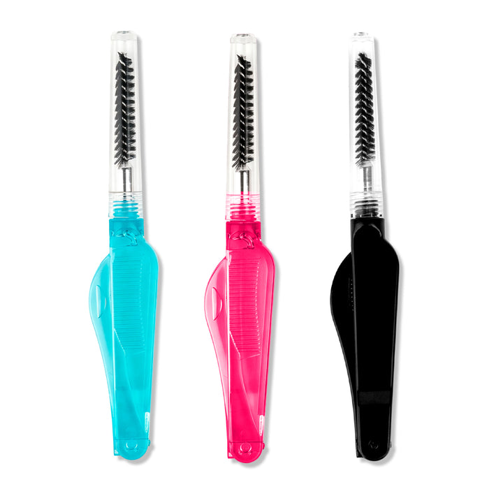 Shelash all-in-one lash comb and brow brush in blue, pink, and black, with fold-out combs and clear spoolie caps.