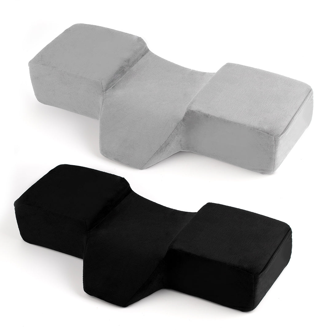 Ergonomic lash pillow with plush velvet cover, zero-pressure support, dual side pockets for tools, holds head steady at ideal working angle.