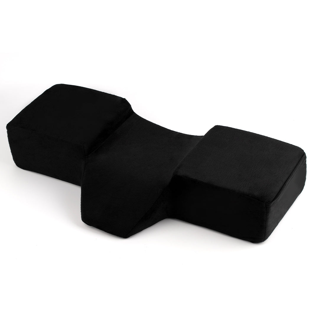 Ergonomic lash pillow with plush velvet cover, zero-pressure support, dual side pockets for tools, holds head steady at ideal working angle.