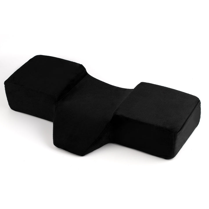 Ergonomic lash pillow with plush velvet cover, zero-pressure support, dual side pockets for tools, holds head steady at ideal working angle.