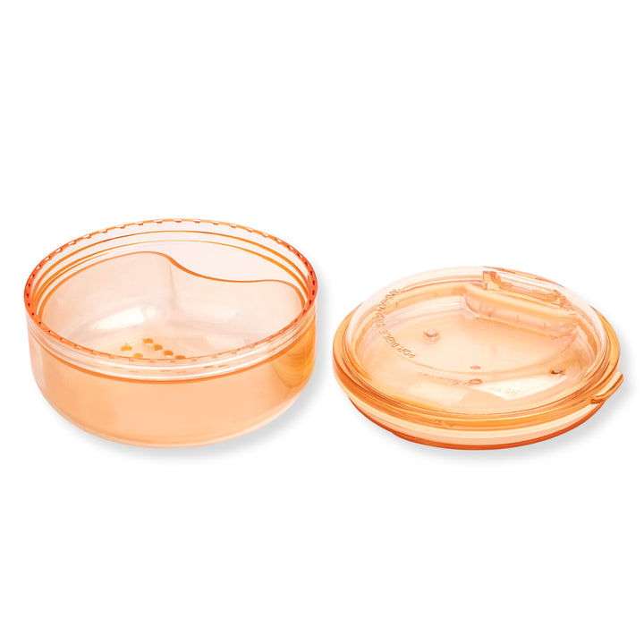 Black and apricot lash lift shield storage and cleaning cases with translucent round bodies and removable lids.