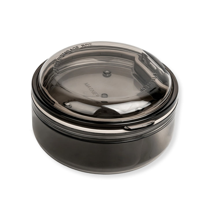 Black and apricot lash lift shield storage and cleaning cases with translucent round bodies and removable lids.