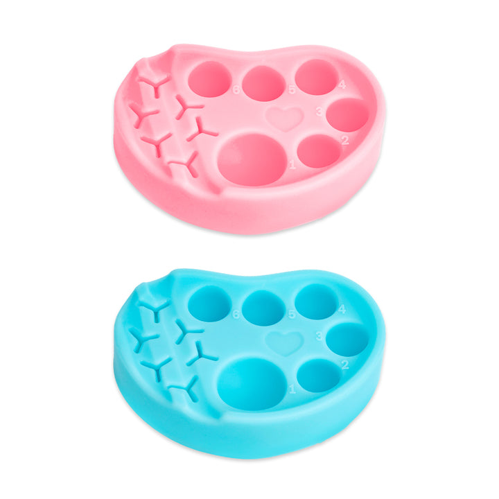 Pink and blue silicone palettes for lash lift and tint, each with six numbered wells and built-in holders for horizontal or vertical tool placement.
