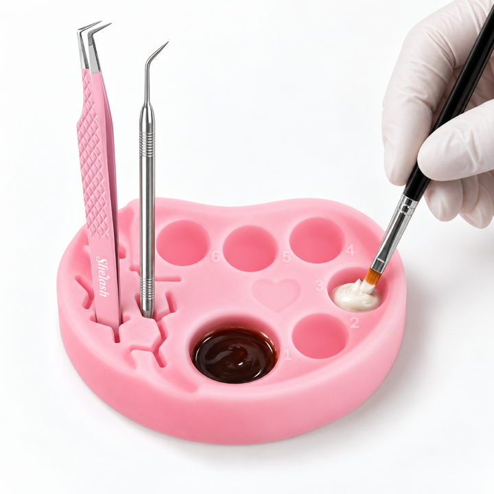 Pink and blue silicone palettes for lash lift and tint, each with six numbered wells and built-in holders for horizontal or vertical tool placement.