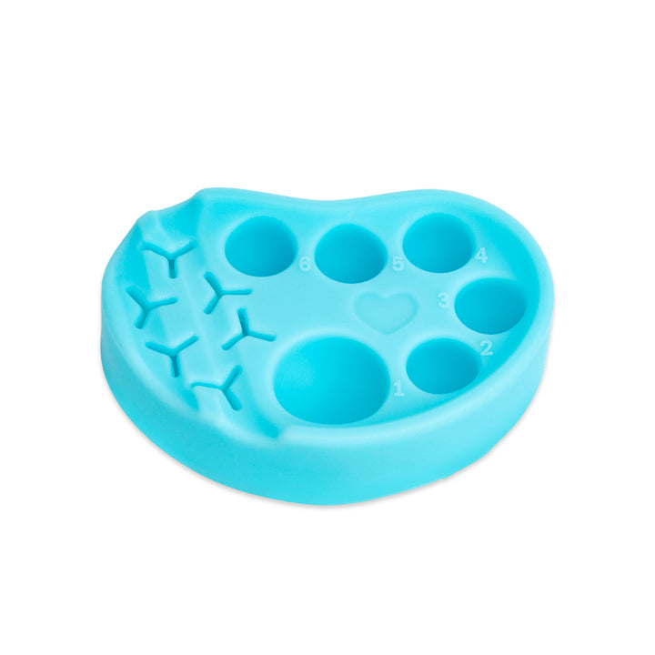 Pink and blue silicone palettes for lash lift and tint, each with six numbered wells and built-in holders for horizontal or vertical tool placement.