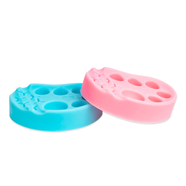 Pink and blue silicone palettes for lash lift and tint, each with six numbered wells and built-in holders for horizontal or vertical tool placement.