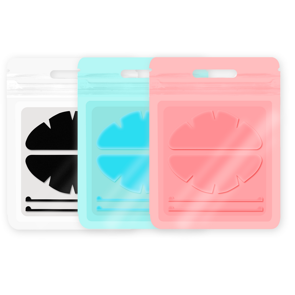 Black, rose-red, and blue silicone eyelid pads with curved shapes and notched edges for lash lift and UV lash extension workflows.