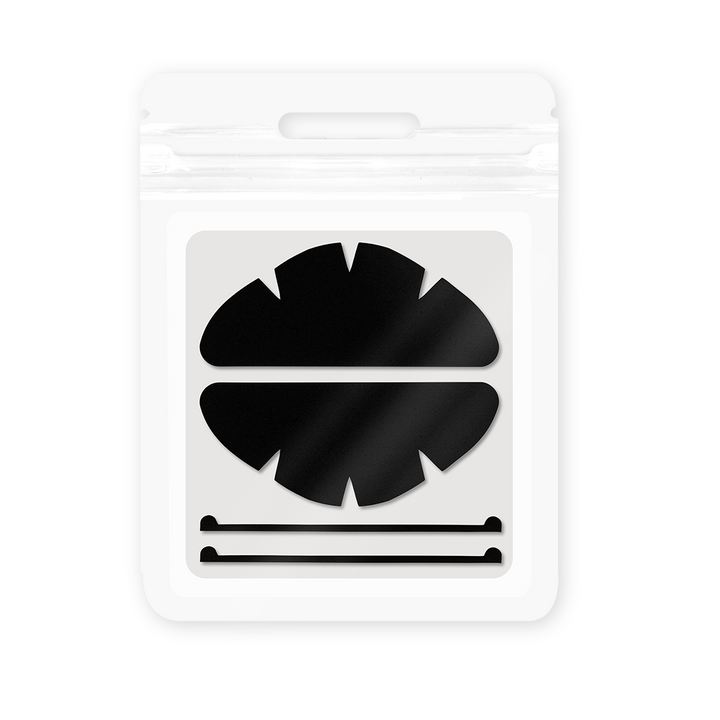 Black, rose-red, and blue silicone eyelid pads with curved shapes and notched edges for lash lift and UV lash extension workflows.